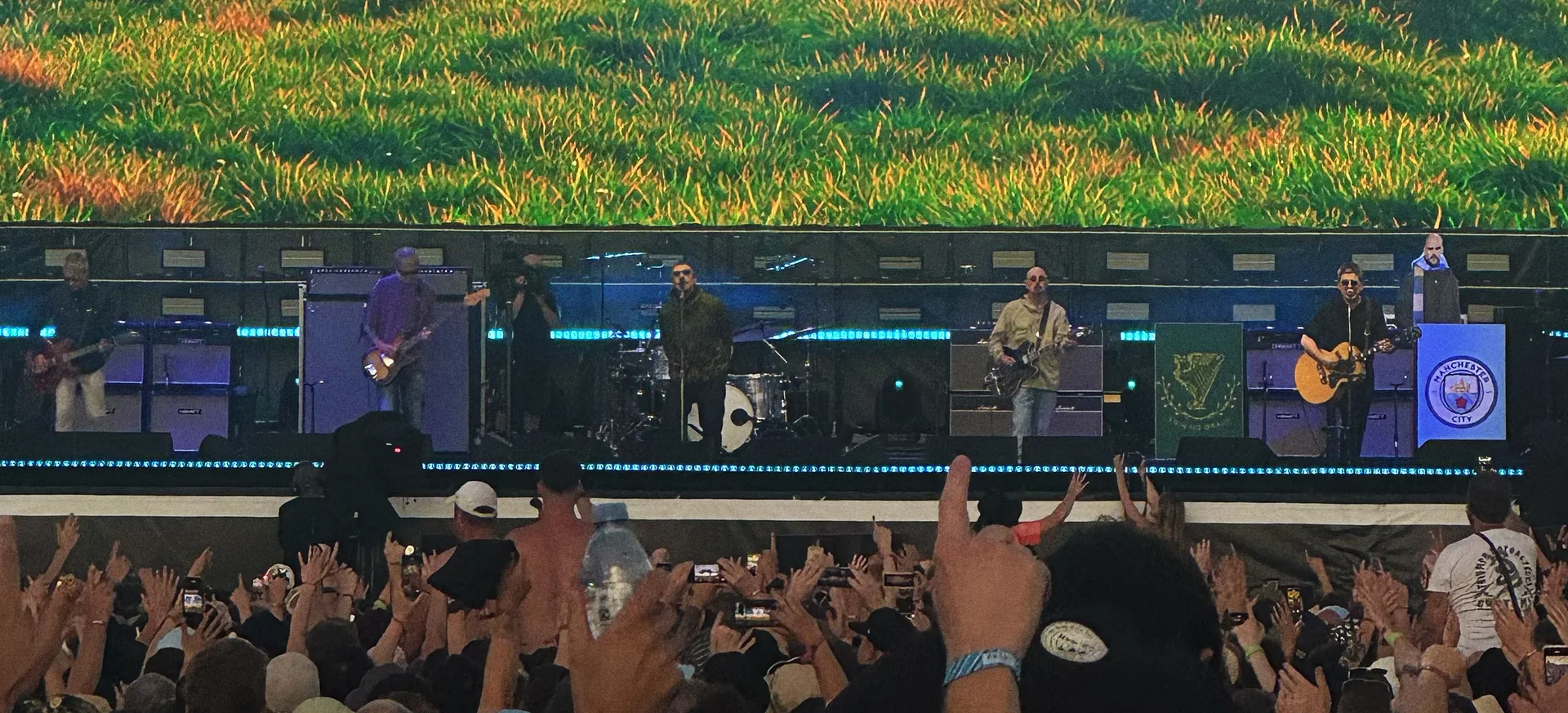 Oasis on stage at Heaton Park, Manchester, in July 2025, in front of a packed crowd