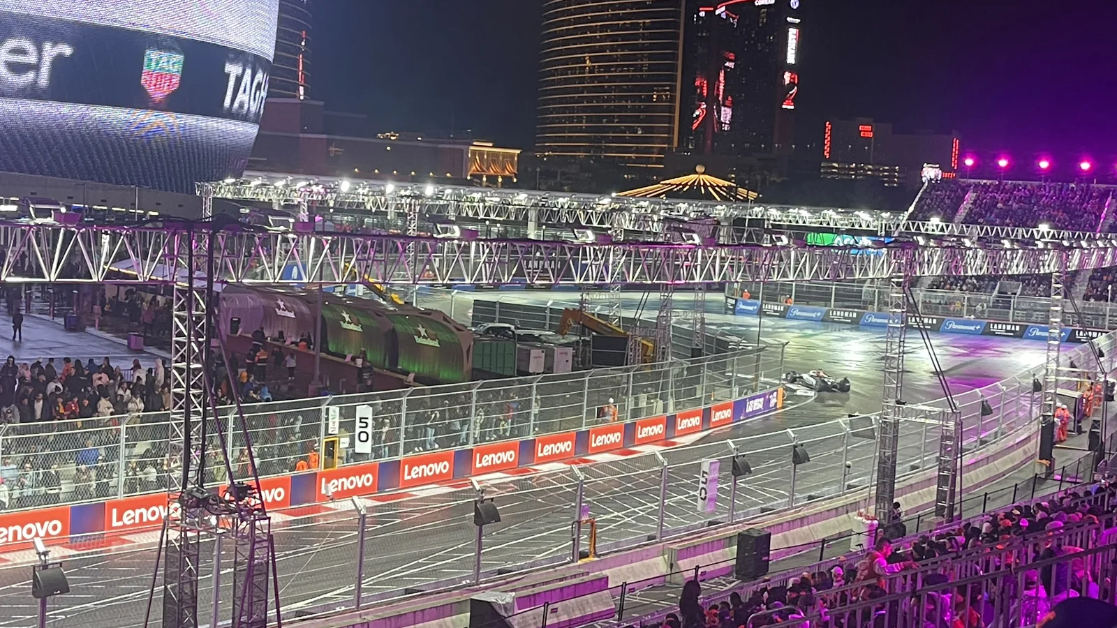 Las Vegas Grand Prix cars racing beside the illuminated Sphere during qualifying